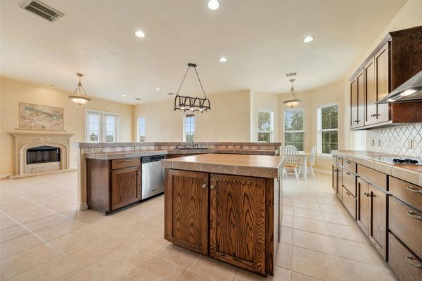 Dining room, Fireplace, Interior, Kitchen, Pendant Lights, Recessed Lighting, Stainless Steel Appliances, Tile Countertops