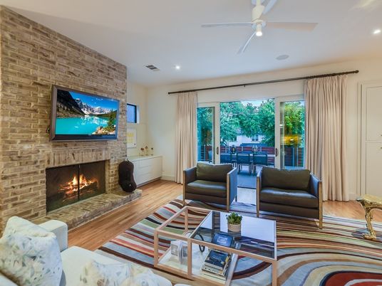 Fireplace, Interior, Living room, Recessed Lighting, Stone Walls, Wood Texture Flooring