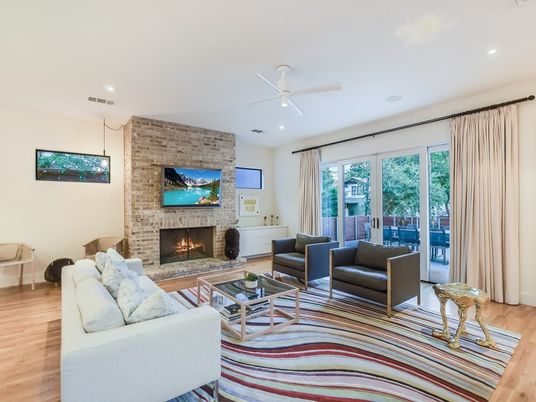 Fireplace, Interior, Living room, Recessed Lighting, Stone Walls, Wood Texture Flooring