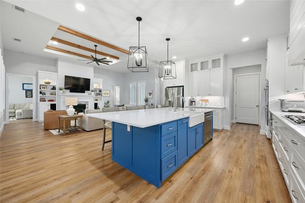Fireplace, Interior, Kitchen, Living room, Pendant Lights, Recessed Lighting, Stainless Steel Appliances, Wood Texture Flooring