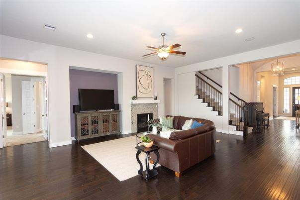 Chandelier, Fireplace, Interior, Living room, Recessed Lighting, Wood Texture Flooring