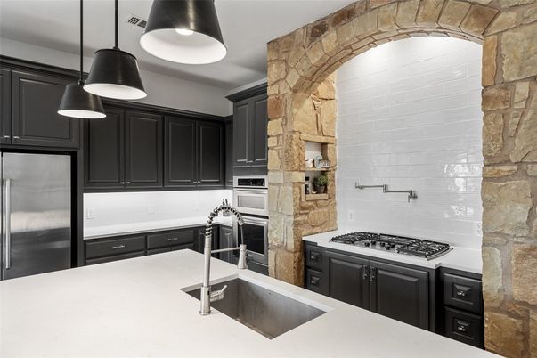 Interior, Kitchen, Pendant Lights, Stainless Steel Appliances, Stone Walls