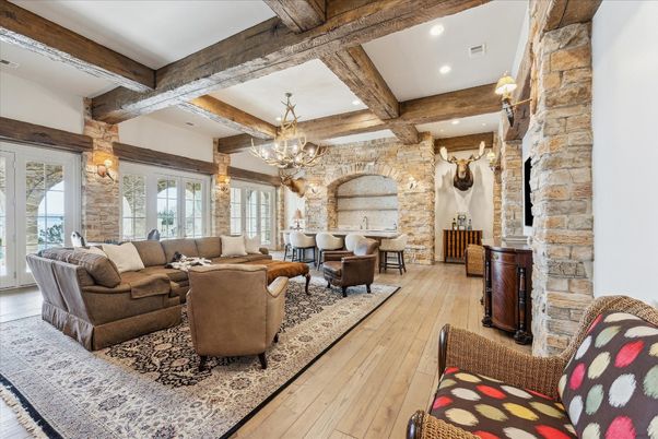 Chandelier, Dining room, Interior, Living room, Recessed Lighting, Stone Walls, Wooden Beams, Wood Texture Flooring