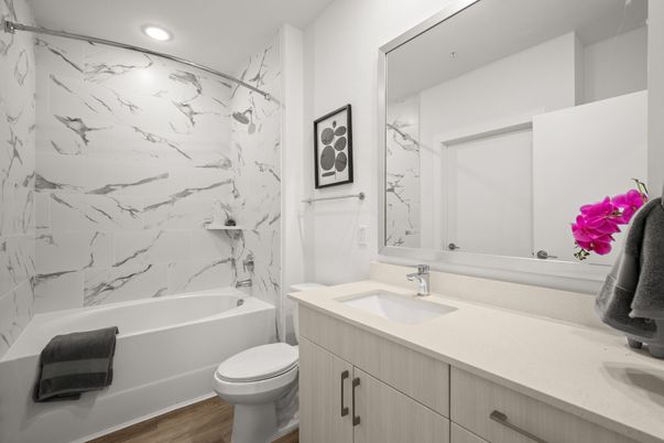 Bathroom, Dual Sink Vanities, Interior, Marble Walls, Recessed Lighting, Wood Texture Flooring