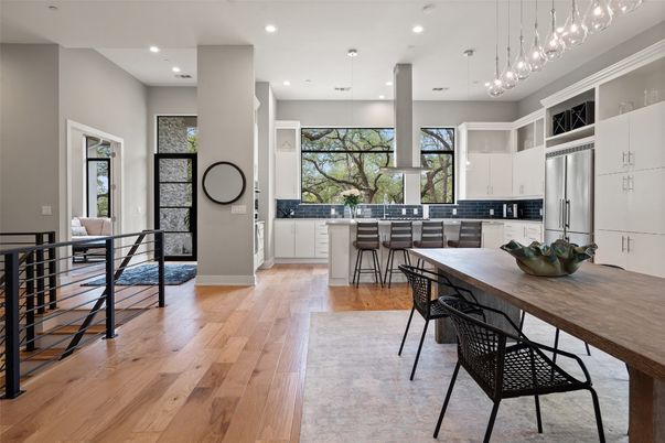 Dining room, Interior, Kitchen, Pendant Lights, Recessed Lighting, Stainless Steel Appliances, Wood Texture Flooring