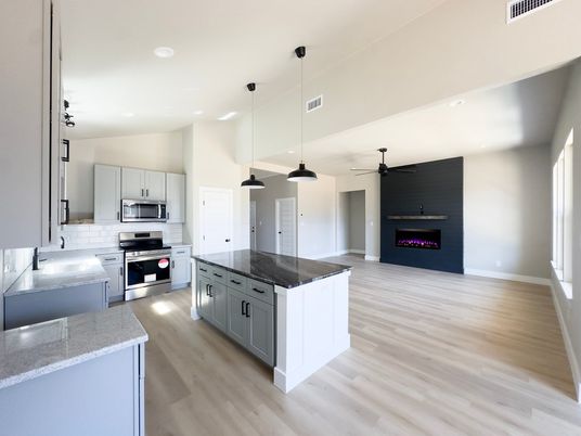 Fireplace, Interior, Kitchen, Pendant Lights, Recessed Lighting, Stainless Steel Appliances, Wood Texture Flooring