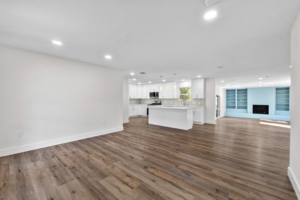 Empty room, Fireplace, Interior, Kitchen, Pendant Lights, Recessed Lighting, Wood Texture Flooring