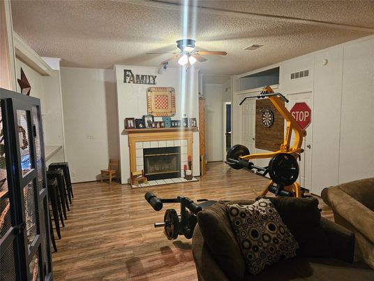 Fireplace, Fitness Equipment, Interior, Wood Texture Flooring