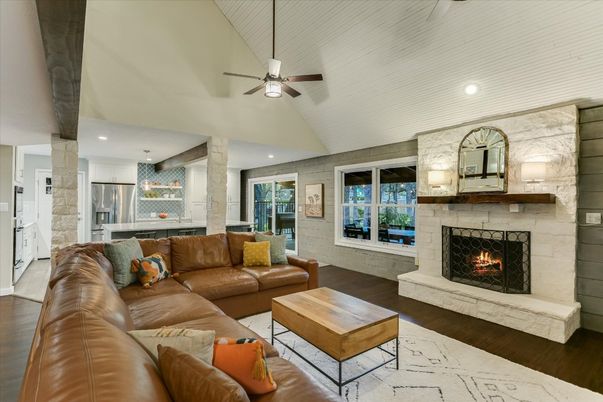 Fireplace, Interior, Kitchen, Living room, Pendant Lights, Recessed Lighting, Stainless Steel Appliances, Stone Walls, Wood Texture Flooring