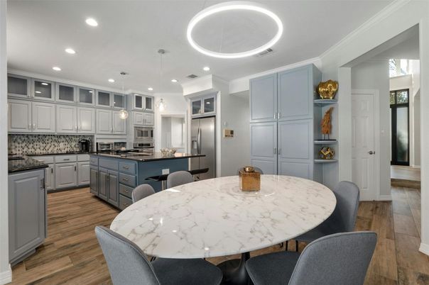 Dining room, Interior, Kitchen, Pendant Lights, Recessed Lighting, Stainless Steel Appliances, Wood Texture Flooring