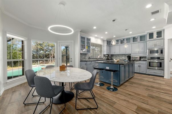 Dining room, Interior, Kitchen, Pendant Lights, Recessed Lighting, Stainless Steel Appliances, Wood Texture Flooring