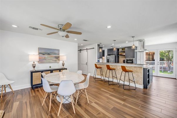 Dining room, Interior, Kitchen, Pendant Lights, Recessed Lighting, Stainless Steel Appliances, Wood Texture Flooring