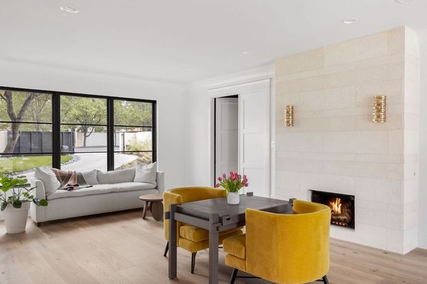 Dining room, Fireplace, Interior, Living room, Recessed Lighting, Stone Walls, Wood Texture Flooring