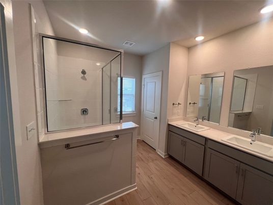 Bathroom, Dual Sink Vanities, Glass Shower, Interior, Recessed Lighting, Wood Texture Flooring