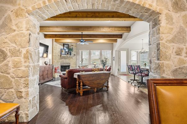 Chandelier, Dining room, Fireplace, Interior, Living room, Stone Walls, Wooden Beams, Wood Texture Flooring