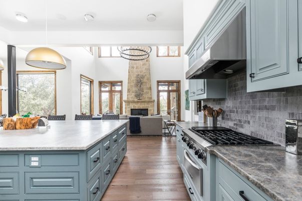 Dining room, Fireplace, Interior, Kitchen, Living room, Pendant Lights, Stainless Steel Appliances, Wood Texture Flooring