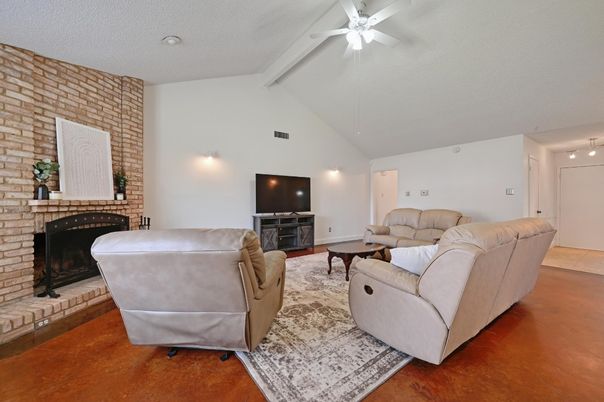 Fireplace, Interior, Living room, Recessed Lighting, Stone Walls, Wood Texture Flooring