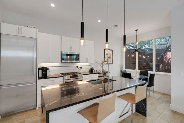 Dining room, Interior, Kitchen, Pendant Lights, Recessed Lighting, Stainless Steel Appliances, Wood Texture Flooring
