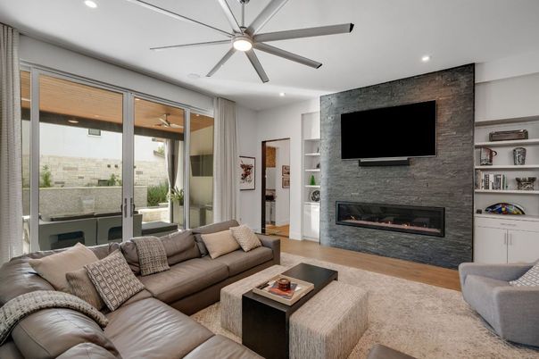 Fireplace, Interior, Living room, Recessed Lighting, Stone Walls, Wood Texture Flooring