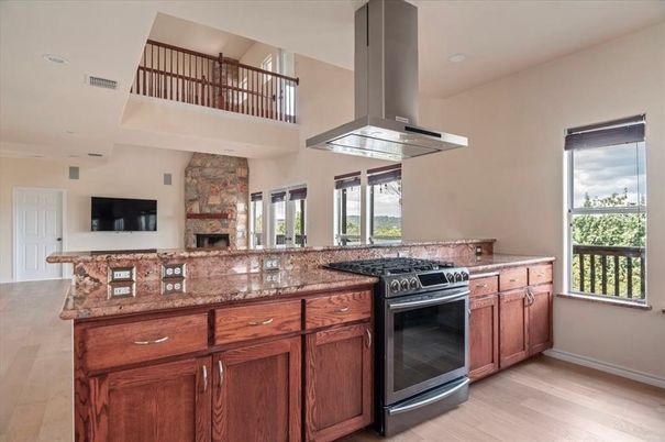 Fireplace, Interior, Kitchen, Recessed Lighting, Stainless Steel Appliances, Wood Texture Flooring