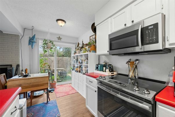 Interior, Kitchen, Stainless Steel Appliances, Stone Walls, Wood Texture Flooring