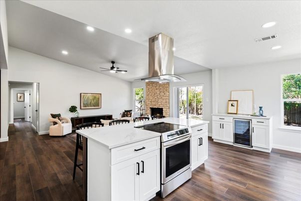 Dining room, Fireplace, Interior, Kitchen, Recessed Lighting, Stainless Steel Appliances, Wood Texture Flooring