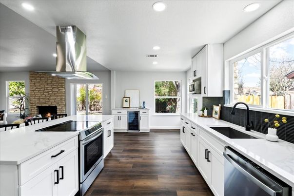 Fireplace, Interior, Kitchen, Recessed Lighting, Stainless Steel Appliances, Stone Walls, Wood Texture Flooring