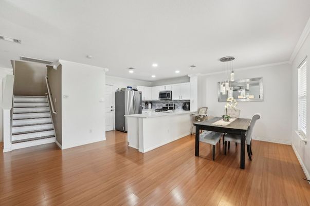 Dining room, Interior, Kitchen, Pendant Lights, Recessed Lighting, Stainless Steel Appliances, Wood Texture Flooring