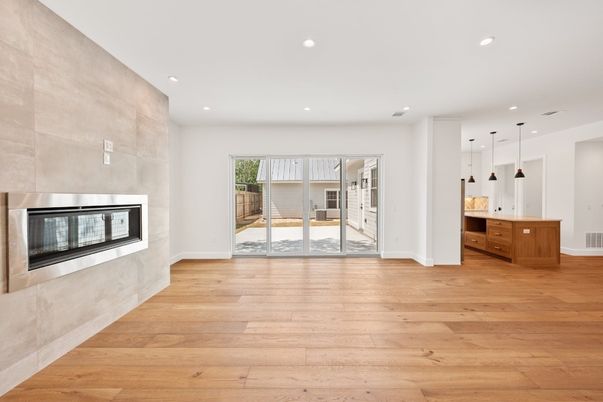 Empty room, Fireplace, Interior, Kitchen, Pendant Lights, Recessed Lighting, Wood Texture Flooring