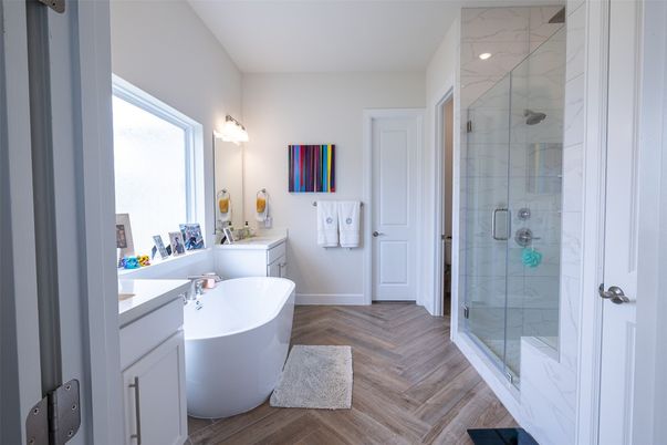 Bathroom, Free Standing Baths, Glass Shower, Interior, Marble Walls, Recessed Lighting, Wood Texture Flooring