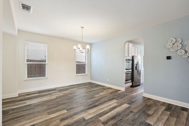 Chandelier, Empty room, Interior, Kitchen, Pendant Lights, Stainless Steel Appliances, Wood Texture Flooring