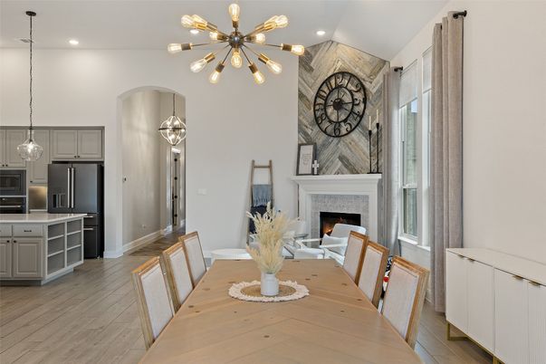 Dining room, Fireplace, Interior, Kitchen, Pendant Lights, Recessed Lighting, Stainless Steel Appliances, Wood Texture Flooring