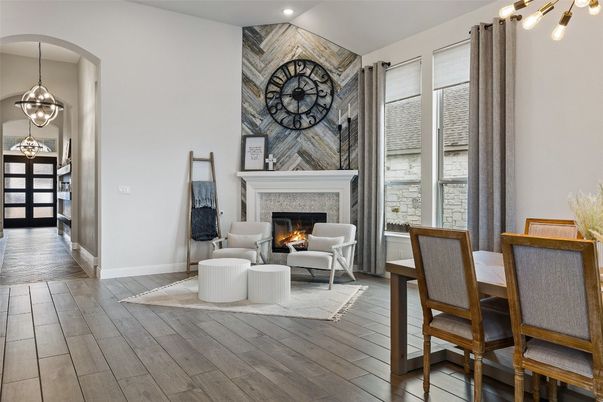 Dining room, Fireplace, Interior, Living room, Pendant Lights, Recessed Lighting, Wood Texture Flooring