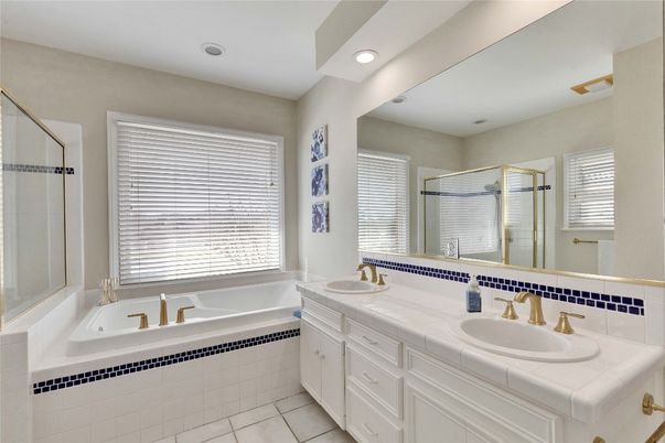 Bathroom, Dual Sink Vanities, Glass Shower, Interior, Recessed Lighting, Tile Countertops