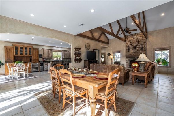 Dining room, Fireplace, Interior, Kitchen, Living room, Recessed Lighting, Stone Walls, Wooden Beams