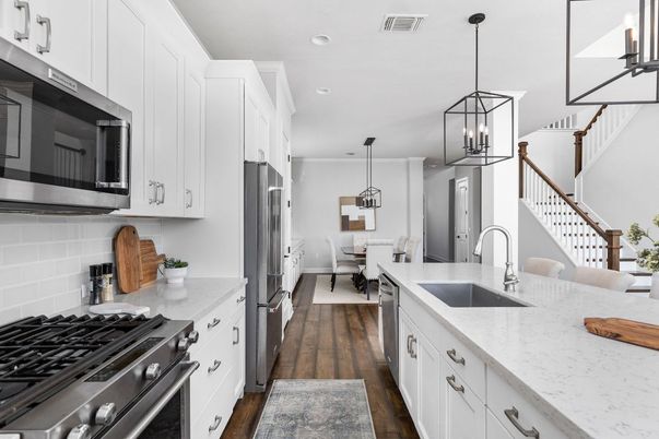 Dining room, Interior, Kitchen, Pendant Lights, Recessed Lighting, Stainless Steel Appliances, Wood Texture Flooring