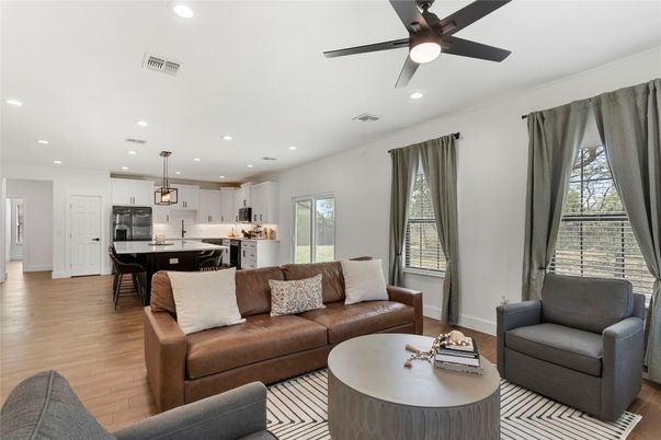 Dining room, Interior, Kitchen, Living room, Pendant Lights, Recessed Lighting, Stainless Steel Appliances, Wood Texture Flooring