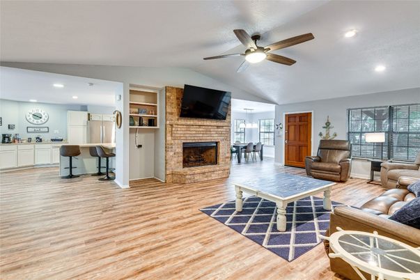 Dining room, Fireplace, Interior, Kitchen, Living room, Recessed Lighting, Stone Walls, Wood Texture Flooring