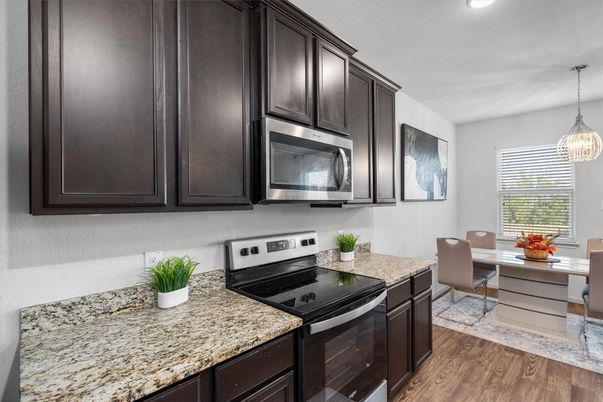 Dining room, Interior, Kitchen, Pendant Lights, Recessed Lighting, Stainless Steel Appliances, Wood Texture Flooring