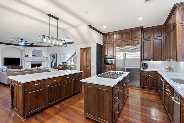 Fireplace, Interior, Kitchen, Living room, Pendant Lights, Recessed Lighting, Stainless Steel Appliances, Wood Texture Flooring