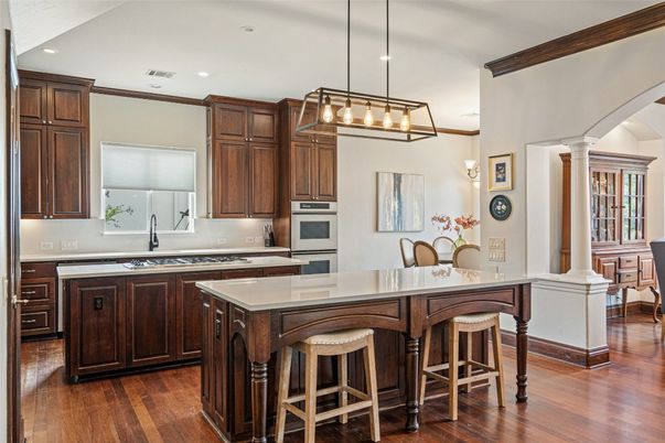 Dining room, Interior, Kitchen, Pendant Lights, Recessed Lighting, Stainless Steel Appliances, Wood Texture Flooring