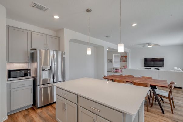 Dining room, Interior, Kitchen, Pendant Lights, Recessed Lighting, Stainless Steel Appliances, Wood Texture Flooring