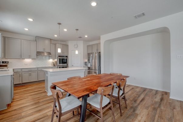 Dining room, Interior, Kitchen, Pendant Lights, Recessed Lighting, Stainless Steel Appliances, Wood Texture Flooring