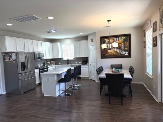 Dining room, Interior, Kitchen, Pendant Lights, Recessed Lighting, Stainless Steel Appliances, Wood Texture Flooring