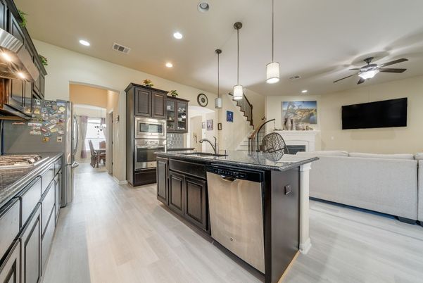 Fireplace, Interior, Kitchen, Living room, Pendant Lights, Recessed Lighting, Stainless Steel Appliances, Wood Texture Flooring