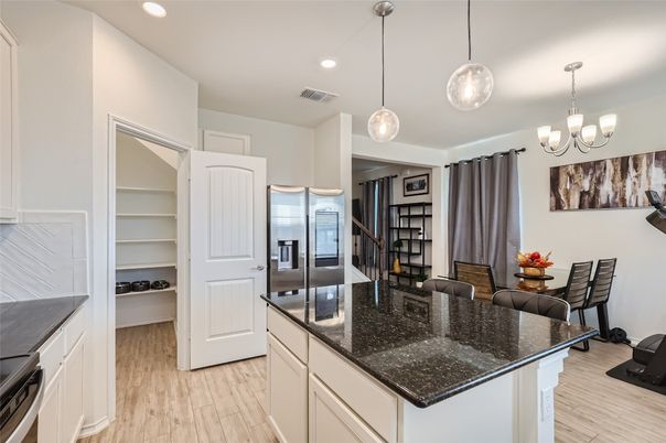 Chandelier, Dining room, Interior, Kitchen, Pendant Lights, Recessed Lighting, Stainless Steel Appliances, Wood Texture Flooring