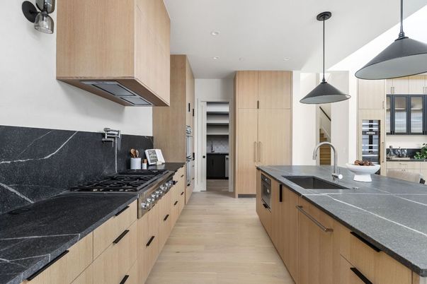 Interior, Kitchen, Pendant Lights, Recessed Lighting, Stainless Steel Appliances, Tile Countertops, Wood Texture Flooring