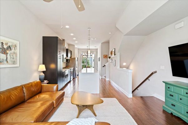 Chandelier, Interior, Kitchen, Living room, Pendant Lights, Recessed Lighting, Stainless Steel Appliances, Wood Texture Flooring