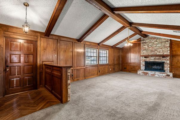 Empty room, Fireplace, Interior, Pendant Lights, Stone Walls, Wooden Beams, Wooden Walls