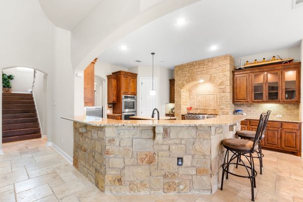 Interior, Kitchen, Pendant Lights, Recessed Lighting, Stainless Steel Appliances, Stone Walls